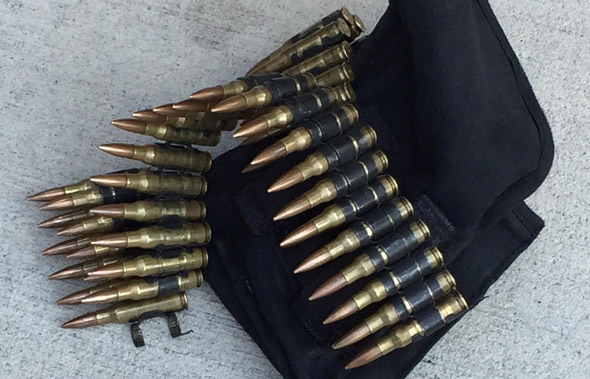 Panic on the bus when man boards with what look like dozens of bullets  strapped to his waist