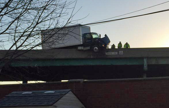 Truck hanging off I-93 in Dorchester