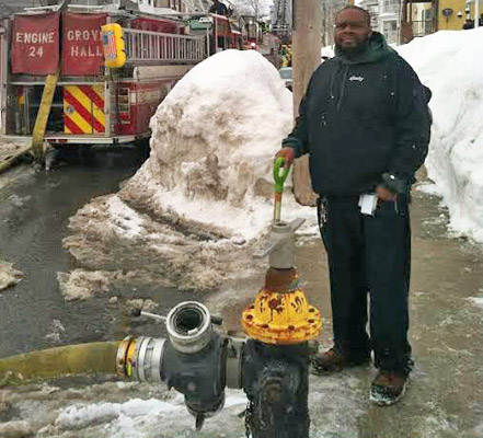Randle Roache and the hydrant he shoveled out