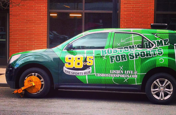 Booted Sports Hub car on Canal Street in Boston