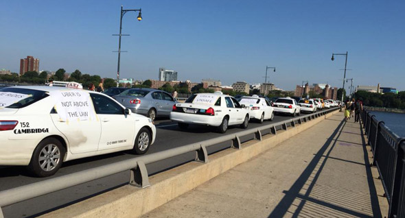 Taxi drivers protest Uber on the Massachusetts Avenue Bridge between Boston and Cambridge