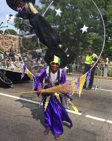 Carnival parade participant on Blue Hill Avenue
