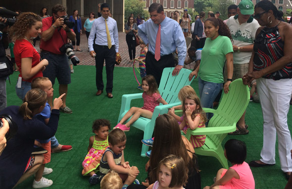 Mayor Walsh on fake grass in front of Boston City Hall