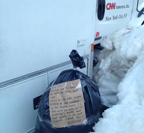 CNN truck and trash bag and note telling CNN to get rid of its trash