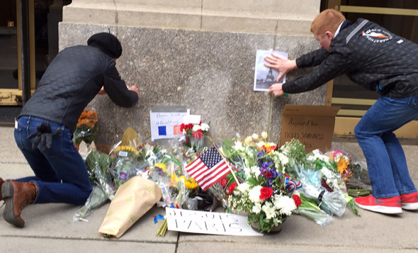 Leaving condolences outside the French consultate in Boston