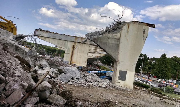 Crumbling Casey Overpass continues to come down