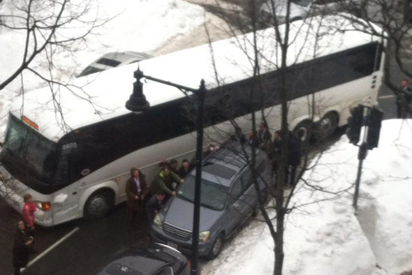 Fed up bus passengers moving a car in the Back Bay