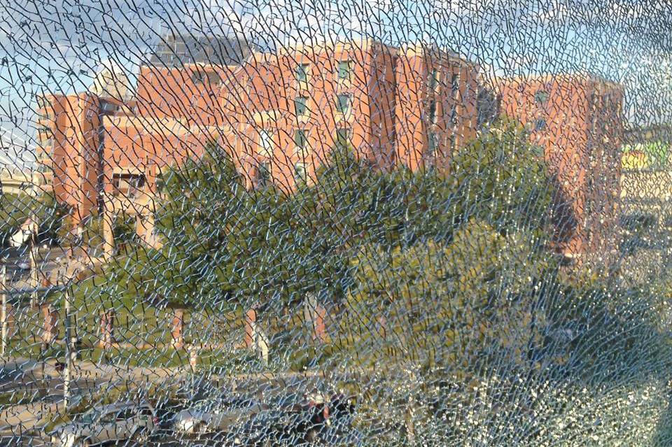 Shattered window at Science Park Green Line station is almost impressionist