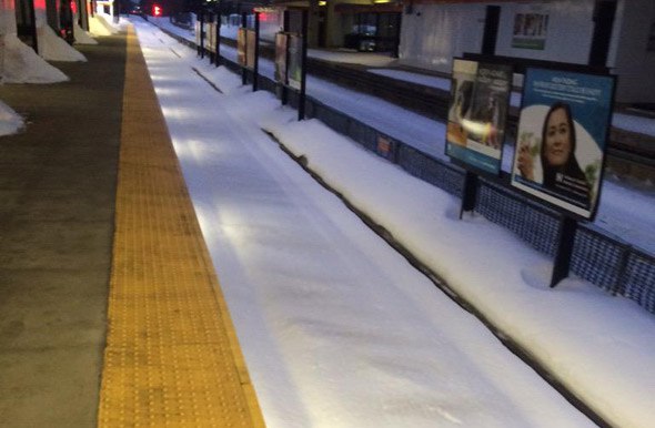 Fresh snow at Oak Grove on the Orange Line