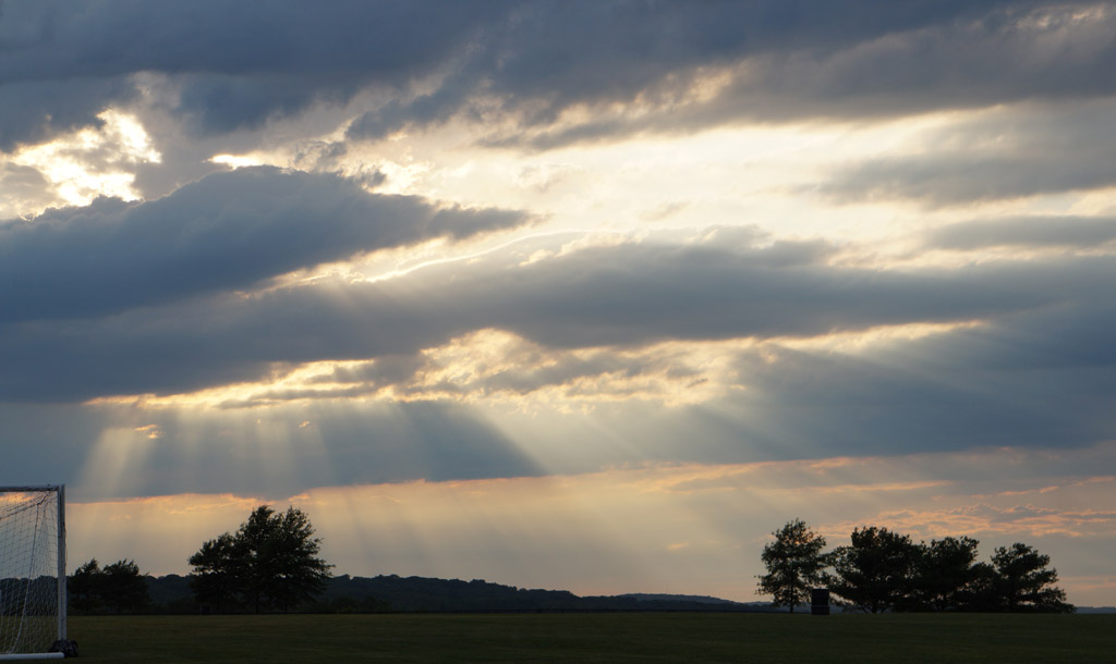 Sun rays after hail storm over Millennium Park in West Roxbury