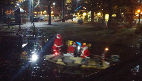 Santa Clauses in a speedboat at the Back Bay Esplanade