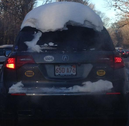 Snow on a car in Newton