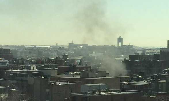 Smoke from tractor trailer fire rises above the North End