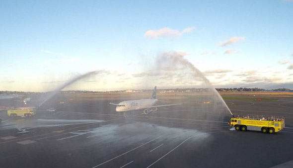 Water-cannon salute for retiring JetBlue pilot at Logan Airport in Boston