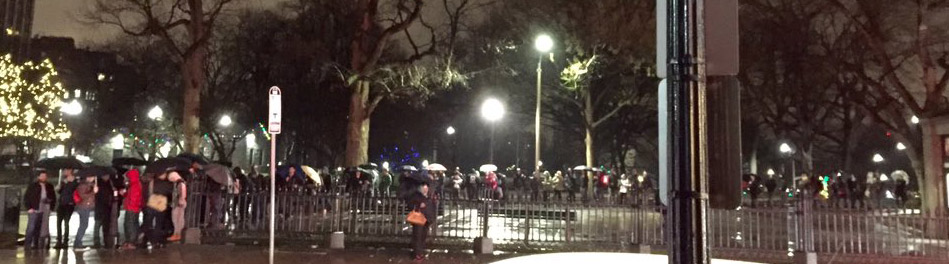 People waiting in the rain to see Star Wars in Boston