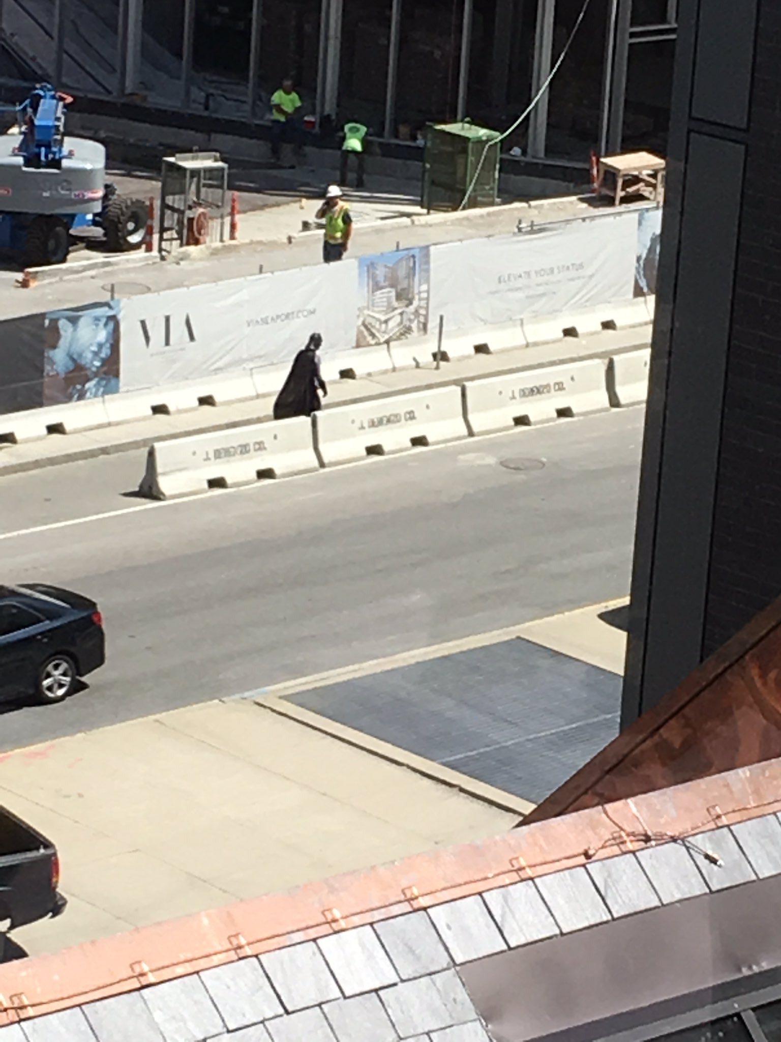Batman wanders around a South Boston waterfront construction zone