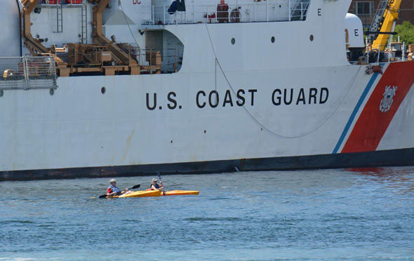 Coast Guard cutter and kayaks in Boston Harbor