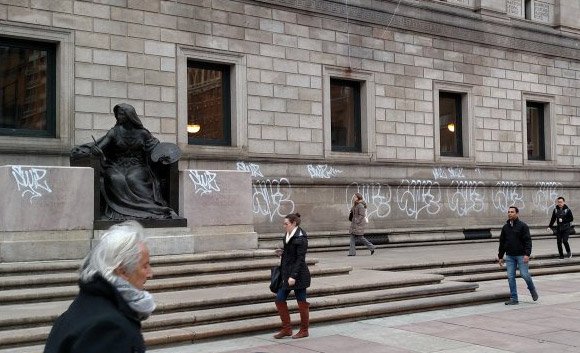 Graffitti on the front of the BPL in Copley Square
