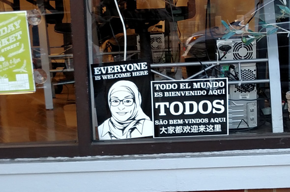 Everyone is Welcome sign in a Roslindale Square store window