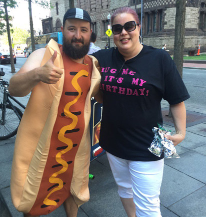 A guy in a hot dog costume in Boston's Back Bay
