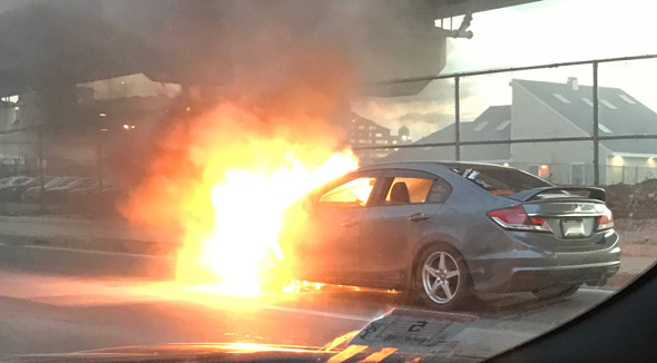 Honda Civic on fire on Frontage Road
