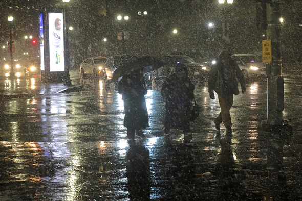 Pedestrians in the snow near North Station
