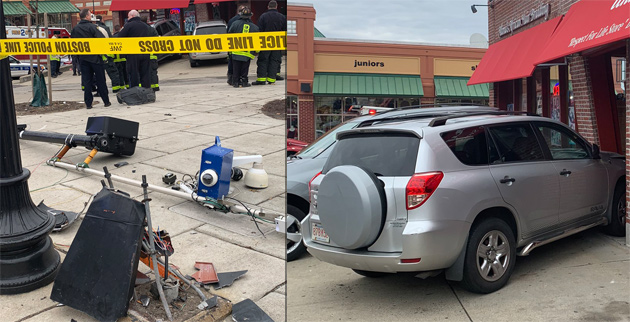 SUV newly enmeshed in front of real-estate office at Washington St. and Blue Hill Ave.