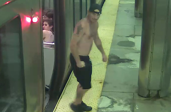 Man getting off train at JFK/UMass