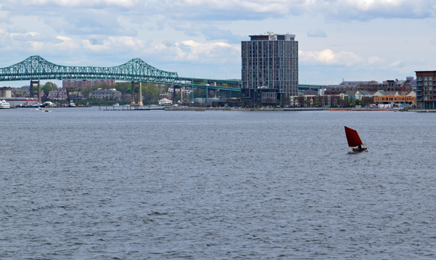 Lone sailboat on Boston Harbor waters