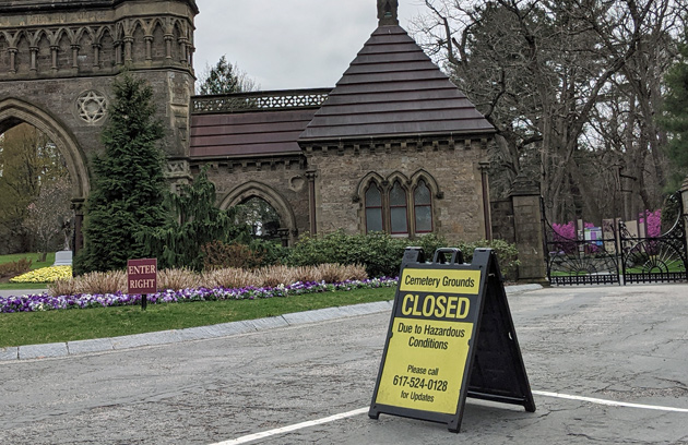 Sign saying Forest Hills Cemetery is now closed