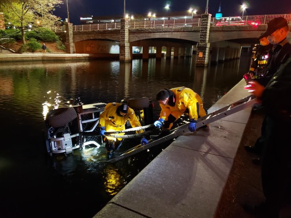 Golf cart being retrieved from Lechmere Canal