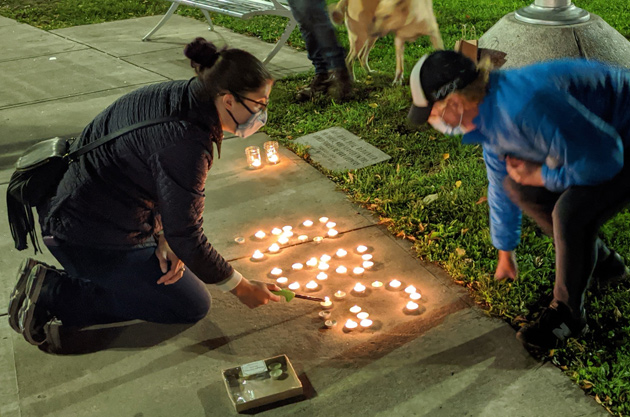 Lighting candles in Ginsburg's honor in Adams Park