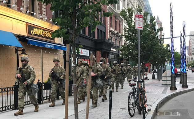 National Guardsmen march past Boston Marathon bombing memorial
