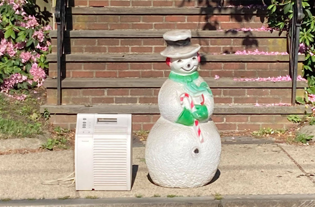 Snowman figure and an air conditioner