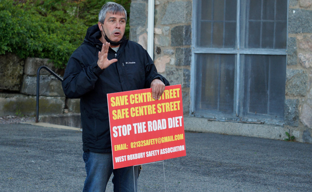 Stephen Morris with a new sign against Centre Street bike lanes