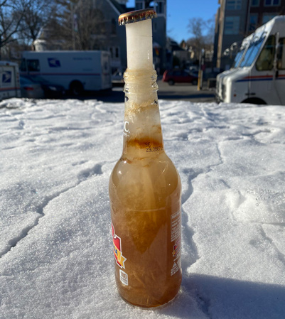 What happens to a soda bottle left in a car trunk overnight