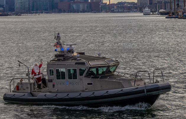 Santa on a State Police boat on the way to Chelsea