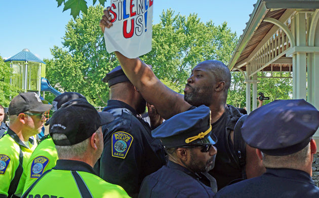 Shaun Nelson blocked by row of cops