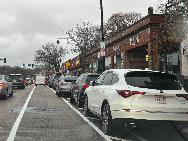 Cars parked in the bike lane, parking lane clear.