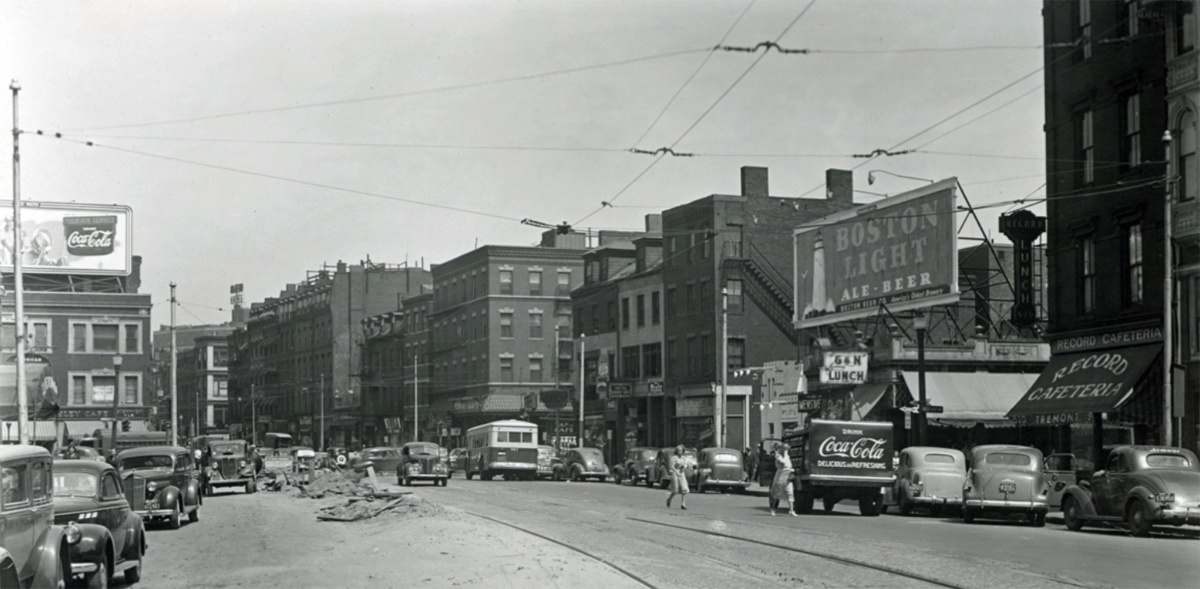 Street scene in old Boston featuring billboard for Boston Light ale and beer