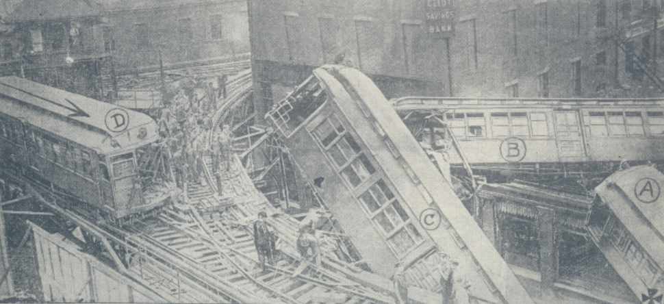 Subway trains lie scattered about curve at Dudley Street
