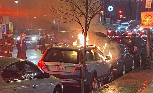 Car on fire outside Brassica in Forest Hills