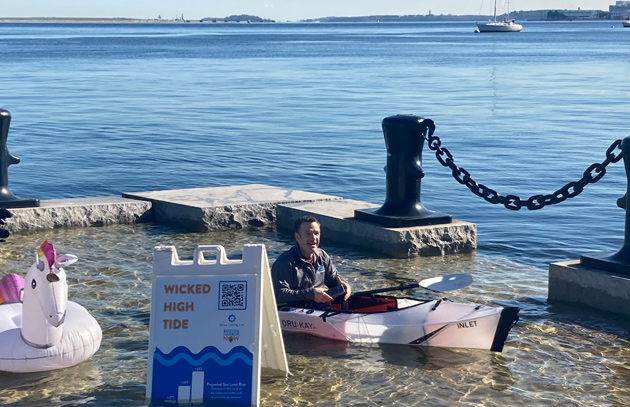 Man in kayak on Long Wharf in 2021