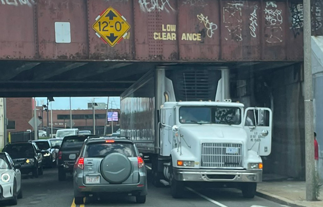 Truck stuck under the Freeport Street Red Line bridge