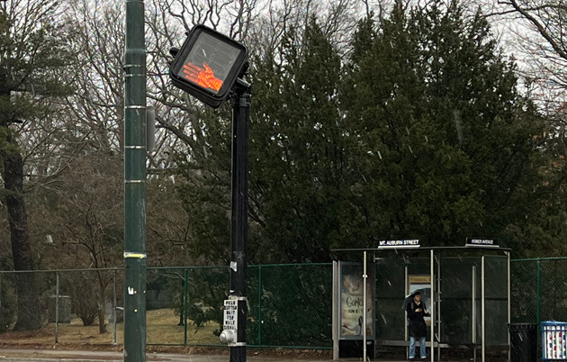 Pedestrian crossing sign knocked out of alignment by wind