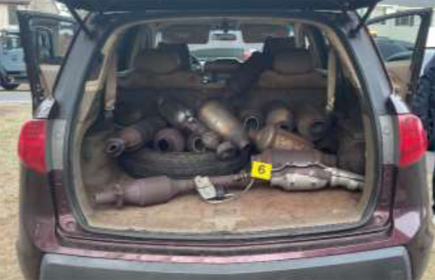 Catalytic converters in the back of the maroon Acura this morning