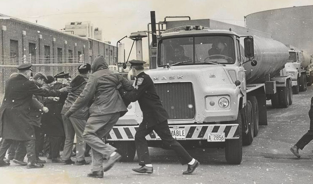 Cops push strikers out of way to let oil trucks pass