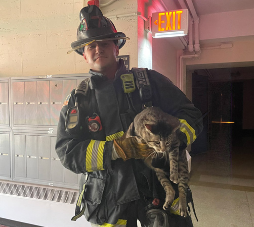 Firefighter with Rascal the Cat