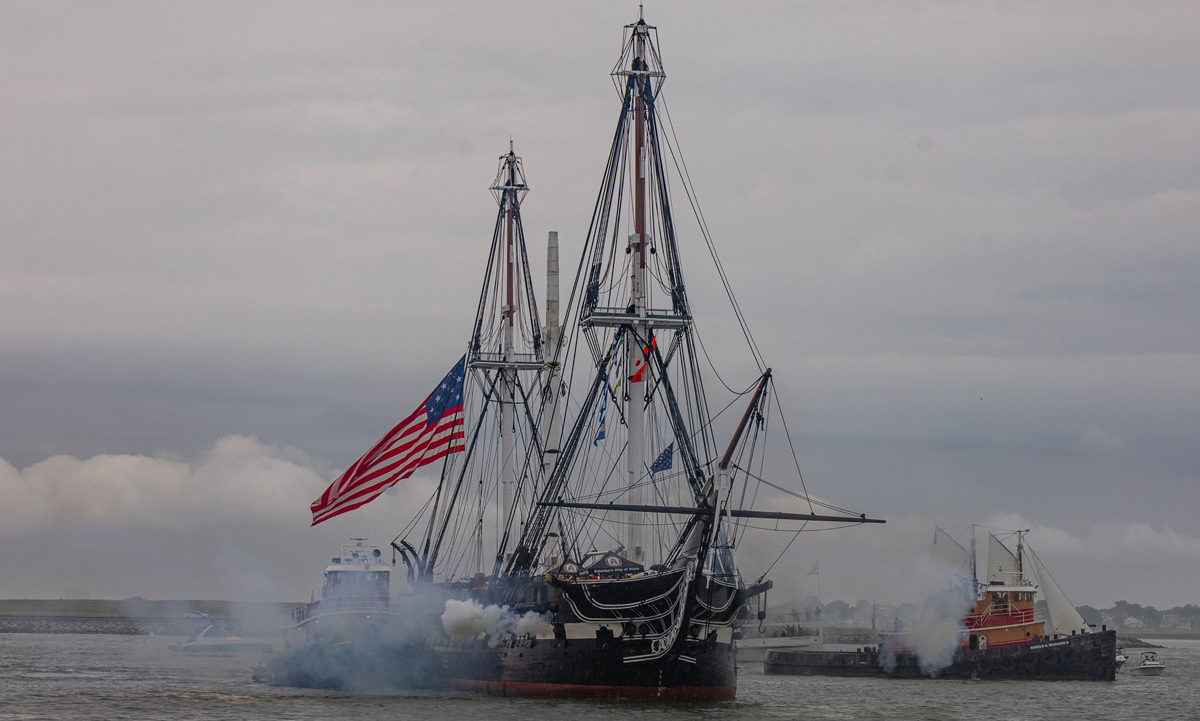 USS Constitution fires cannons to answer salute from Fort Independence