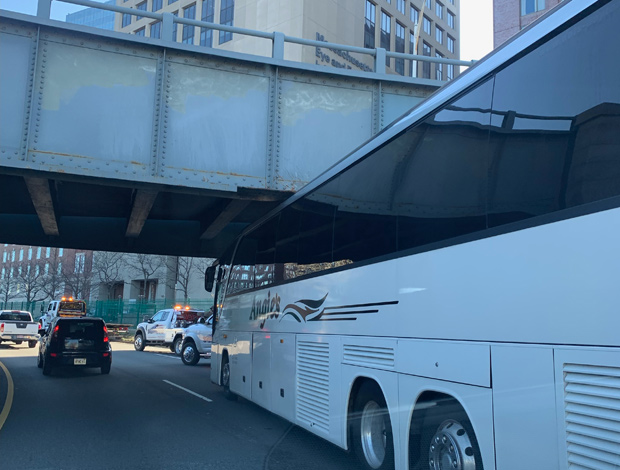 Bus stuck under a bridge on Storrow Drive